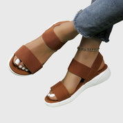 Solène Faircastle | Black Double-Strap Flat Sandals with White Sole