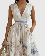 Édith Ravencombe | Floral Pleated Midi Dress with Deep V-Neck