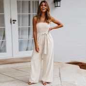 Clarisse Fontenard | Strapless Tie Waist Wide Leg Jumpsuit in Beige