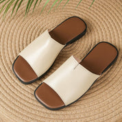 Margolaine Dubreuil | Black Faux Leather Flat Slide Sandals