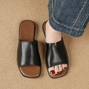 Margolaine Dubreuil | Black Faux Leather Flat Slide Sandals