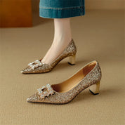 Estelle Ravenswood | Gold Glitter Block Heel Pumps with Crystal Buckle