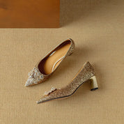 Estelle Ravenswood | Gold Glitter Block Heel Pumps with Crystal Buckle