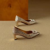 Estelle Ravenswood | Gold Glitter Block Heel Pumps with Crystal Buckle