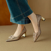 Estelle Ravenswood | Gold Glitter Block Heel Pumps with Crystal Buckle