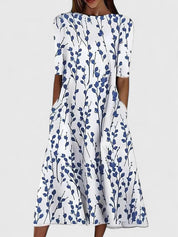 Auriane Delfortaine | Blue Floral Print Midi Dress with Short Sleeves