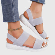 Solène Faircastle | Black Double-Strap Flat Sandals with White Sole