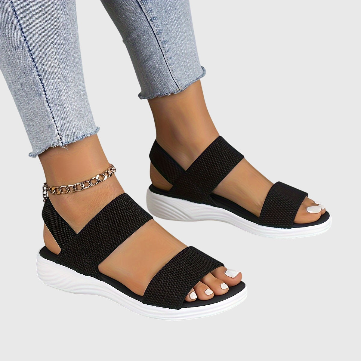 Solène Faircastle | Black Double-Strap Flat Sandals with White Sole