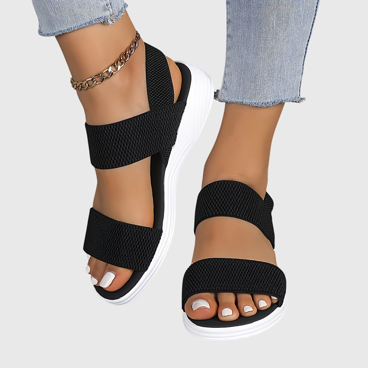 Solène Faircastle | Black Double-Strap Flat Sandals with White Sole