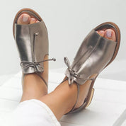Serephina Valthorpe | Pewter Metallic Open-Toe Flat Sandals with Bow Strap
