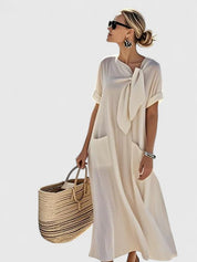 Nadège Villefort | Brown Maxi Dress with Neck Tie & Pockets