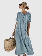 Nadège Villefort | Brown Maxi Dress with Neck Tie & Pockets
